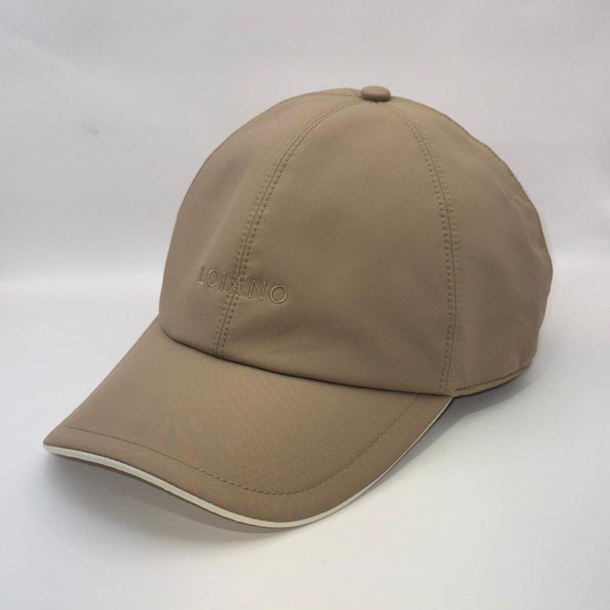 Beige baseball cap on a white background